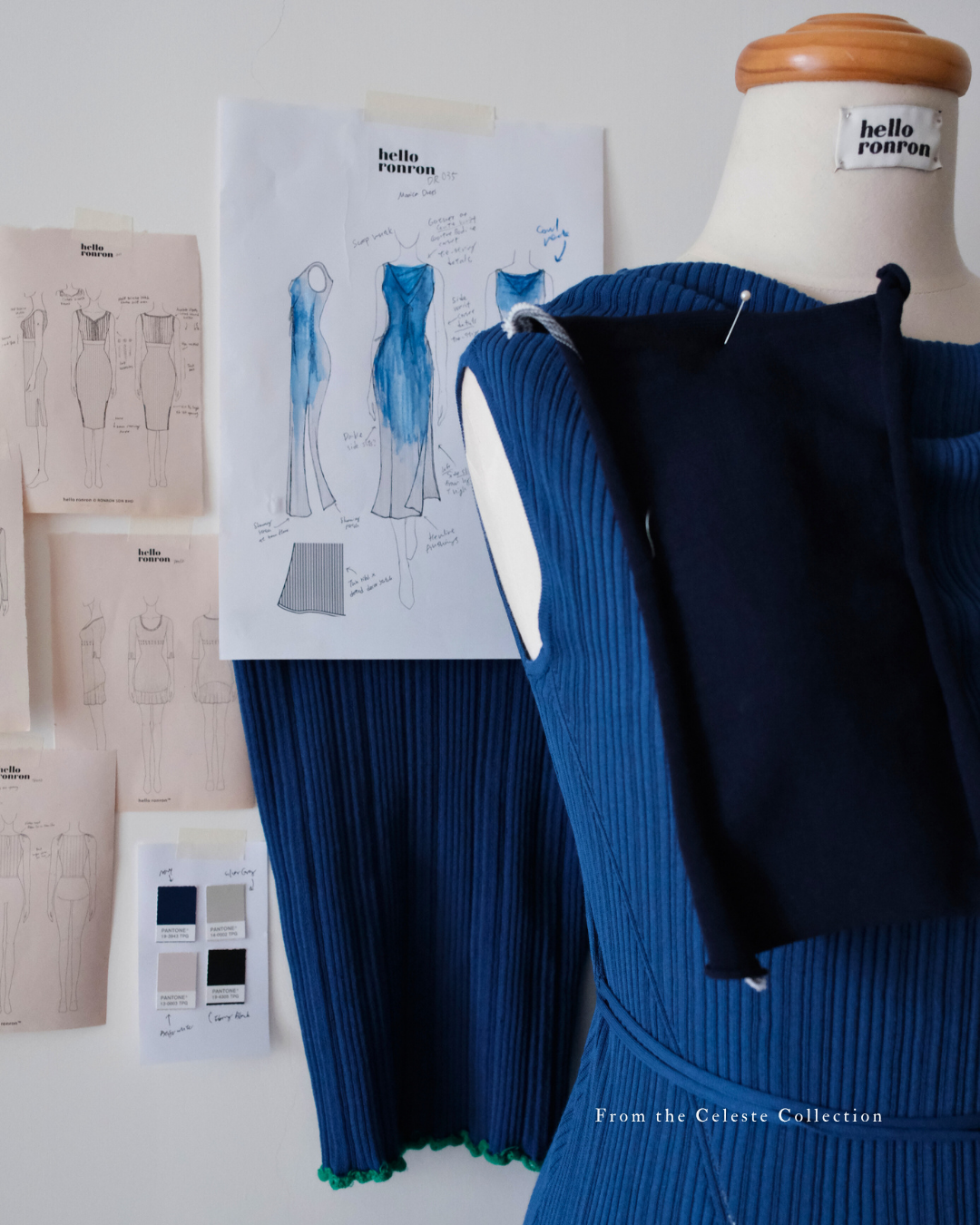 hello ronron | Behind the scenes at hello ronron's atelier—a mannequin with an in-development navy blue knit dress and a wall of sketches.