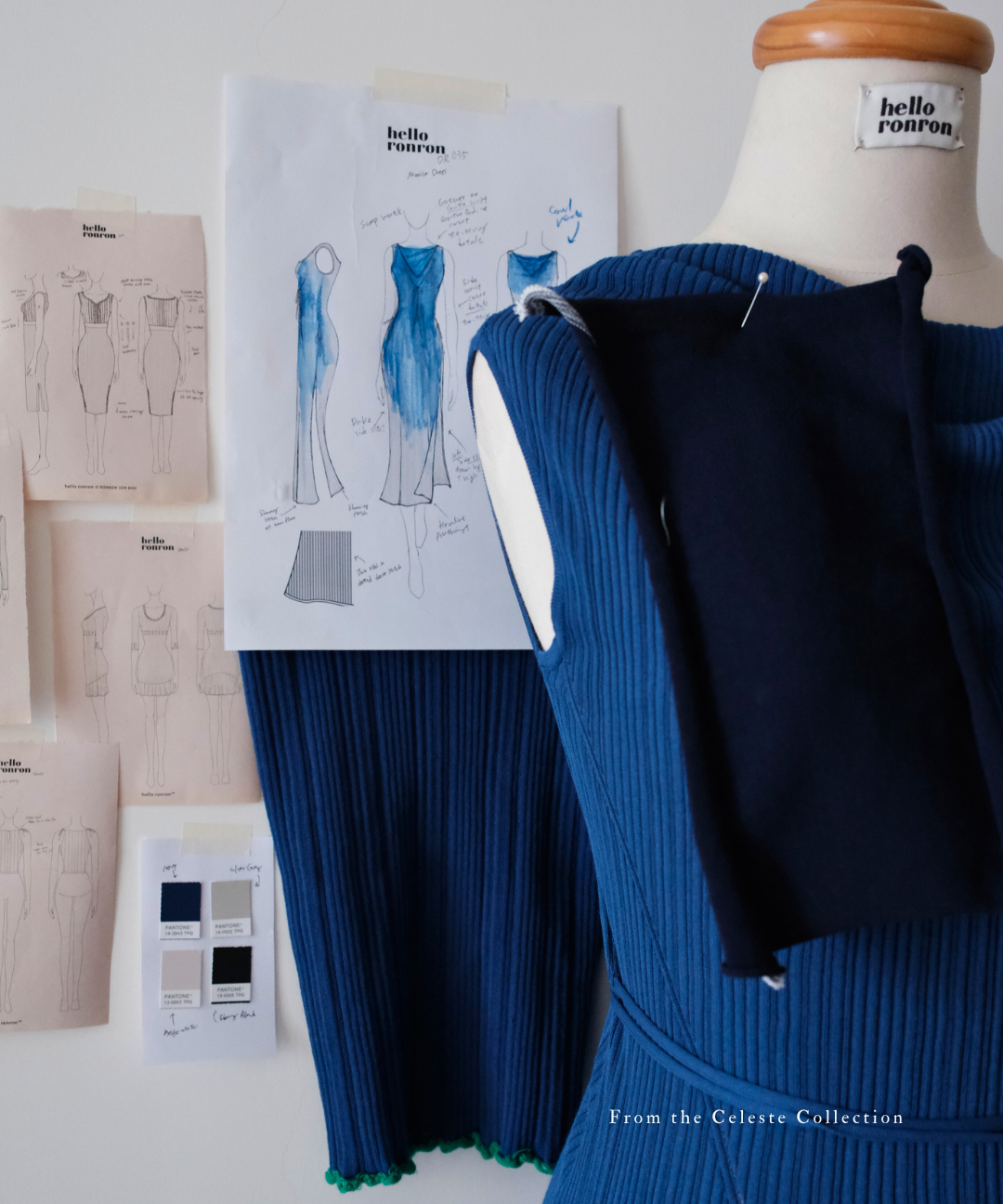 hello ronron | Behind the scenes at hello ronron's atelier—a mannequin with an in-development navy blue knit dress and a wall of sketches.